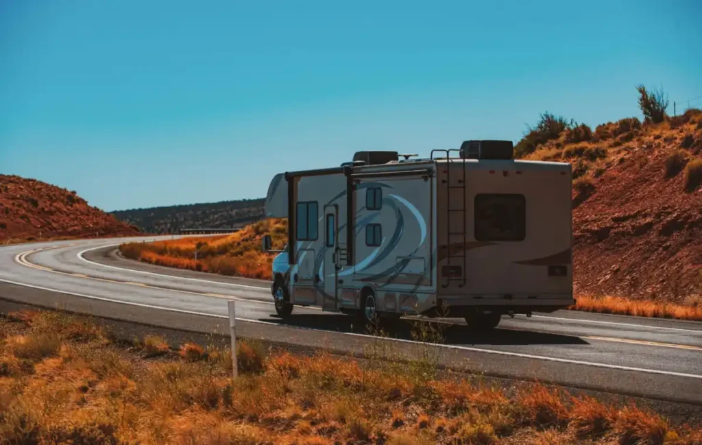 Motorhome traveling along a winding desert highway